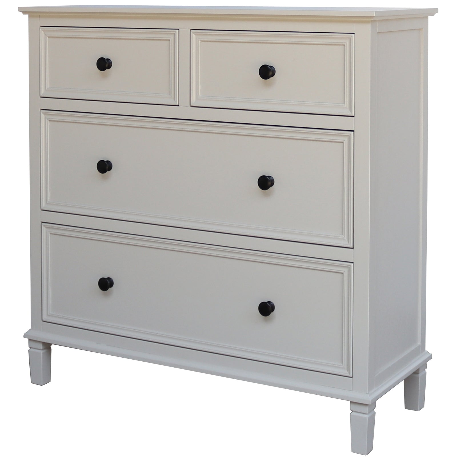 White dresser with four drawers and black knobs on a white background