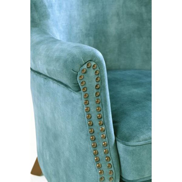 Havenheim Furniture Cromarty armchair in vintage teal fabric with wooden legs, showcasing a cozy, stylish living room setting.