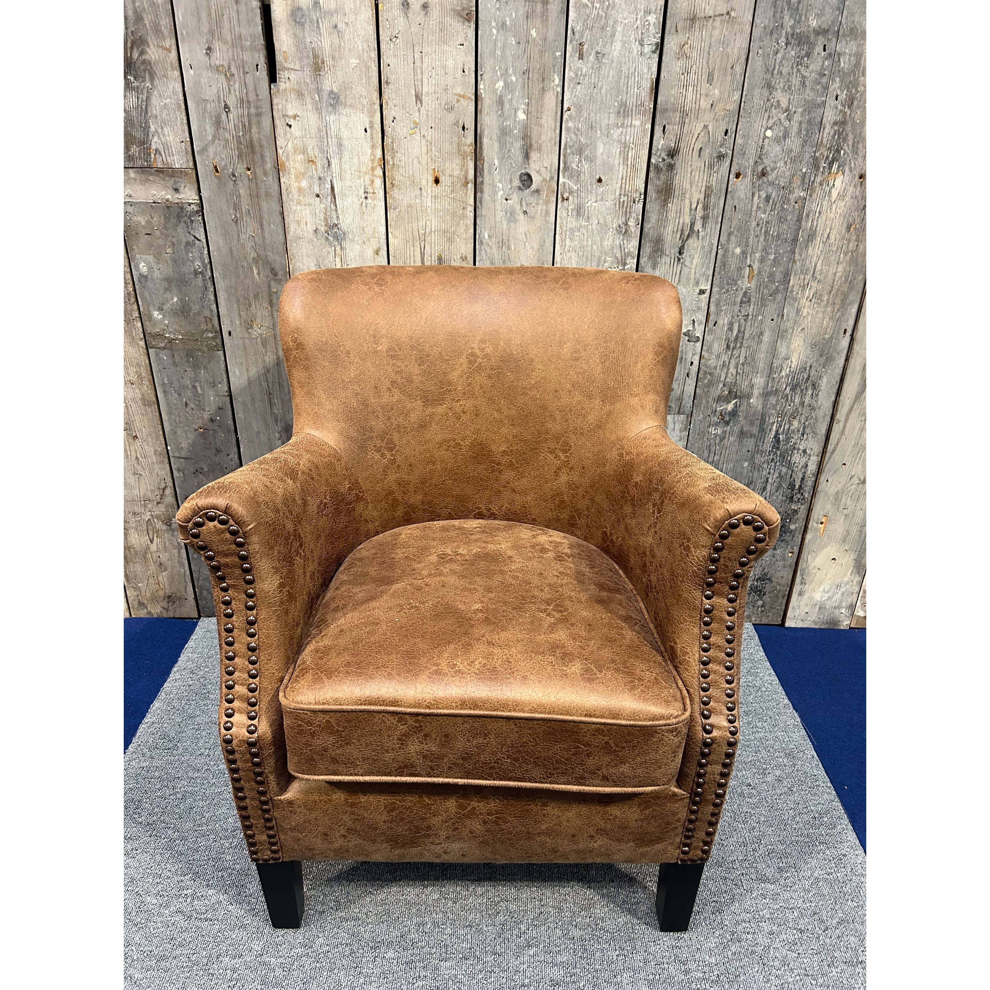 Havenheim Furniture Cromarty armchair in vegan vintage leather with a stylish, comfortable design and classic silhouette.