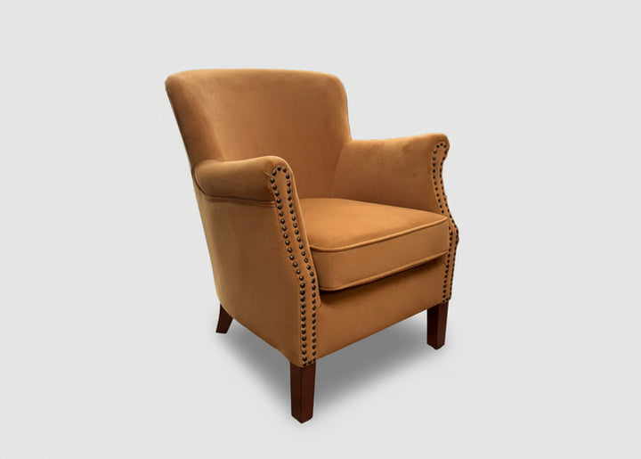 Ancient Mariner Cromarty armchair in brushed gold velvet with plush upholstery and modern design, perfect for stylish living spaces.