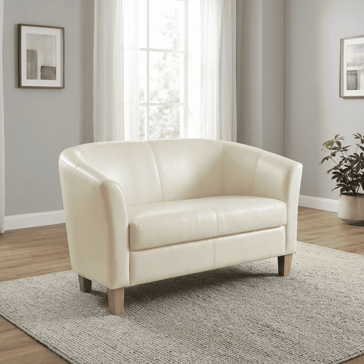 Heartlands Furniture Claridon 2 seater sofa in cream PU faux leather, shown against a plain background