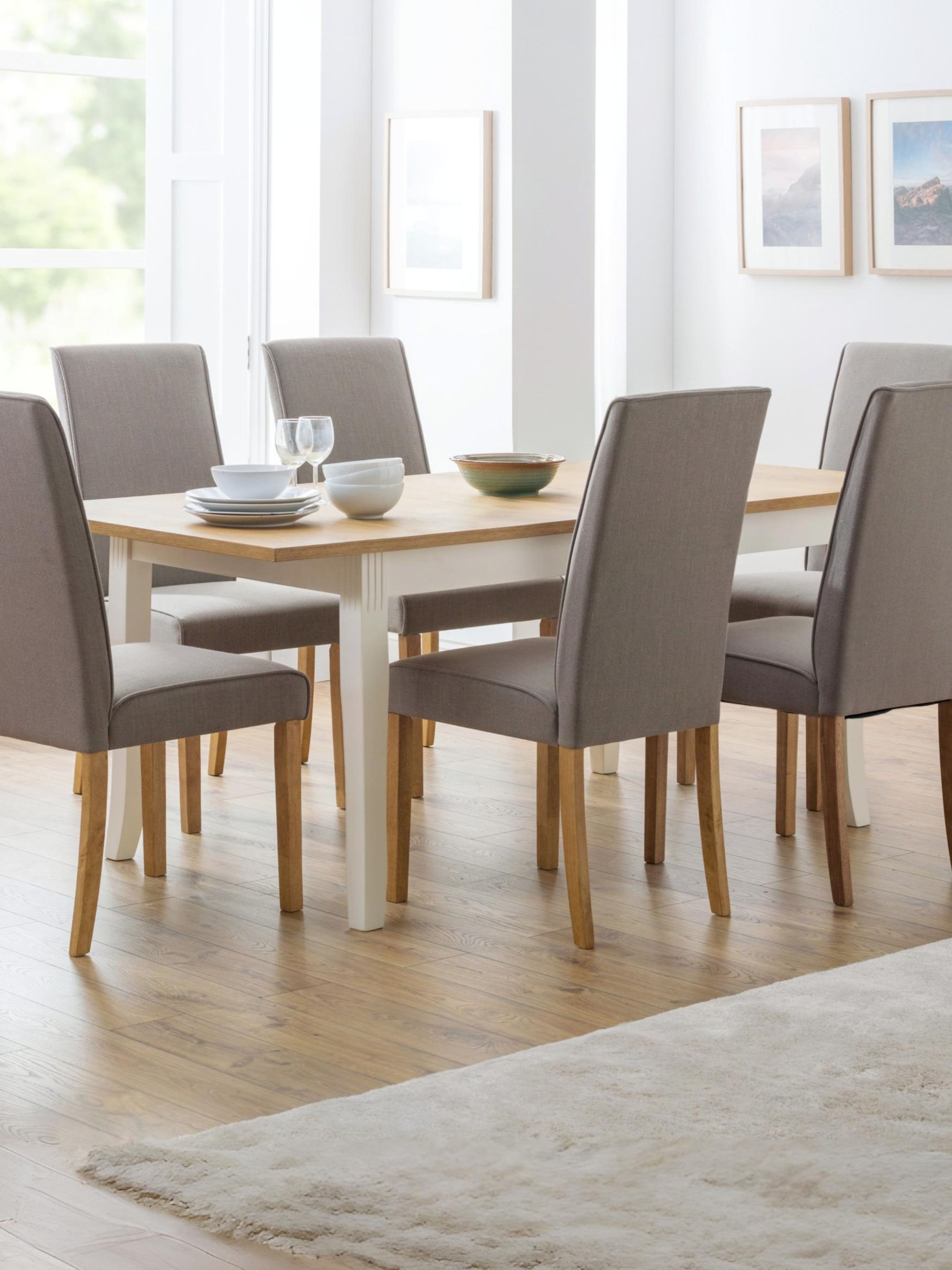 Julian Bowen Davenport extending dining table, 4-6 seater, ivory and oak effect finish in a dining room setup