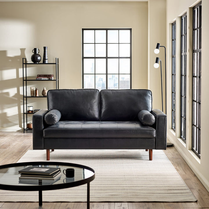 Julian Bowen Henley 3-seater sofa with bolsters in black faux leather, shown in a stylish living room setting.