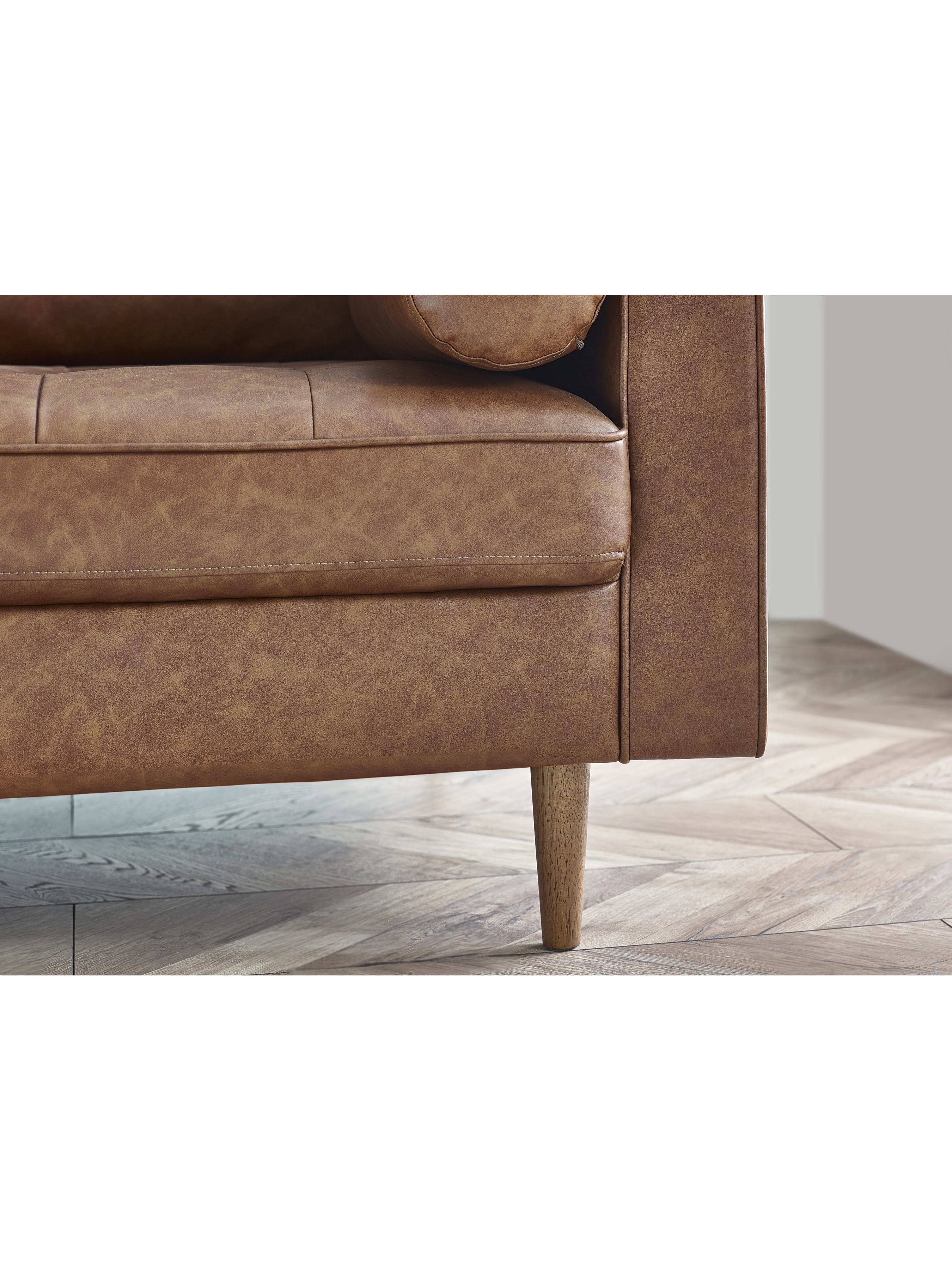Close-up of Julian Bowen Henley 2 Seater sofa in brown tan faux leather with bolster cushions and wooden legs.