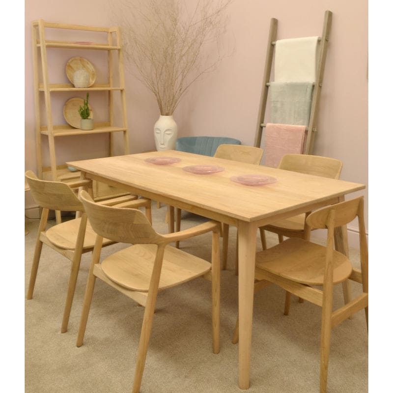 Ancient Mariner Shoreditch 1.6m dining table in Sungkai wood, shown in a stylish dining room setting