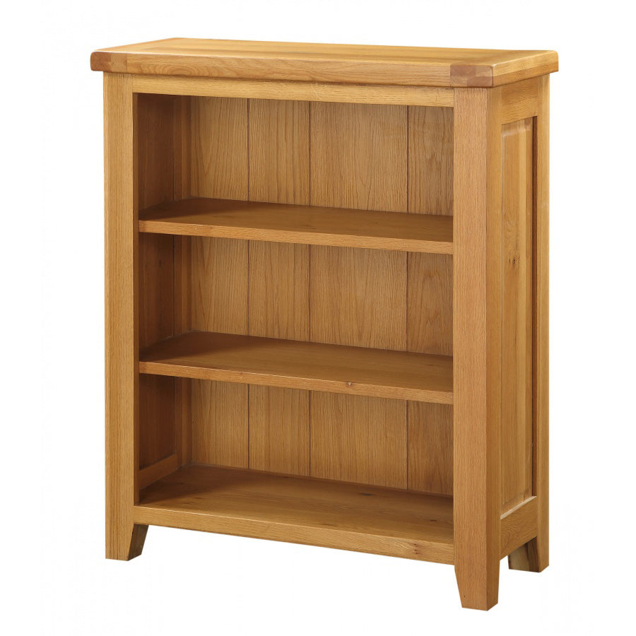 Solid oak small bookcase from Heartlands Furniture featuring multiple shelves and a natural wood finish.